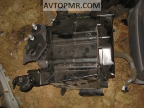 The bare air conditioner housing, left side of a Mazda CX-7.