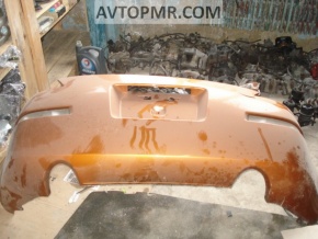 Bare rear bumper with damage on a Nissan 350z.
