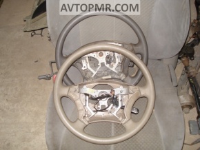 Naked steering wheel for a Toyota Sienna 2010 with beige tires