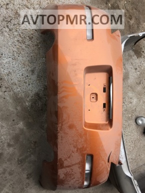 Bare rear bumper with damage on a Nissan 350z.