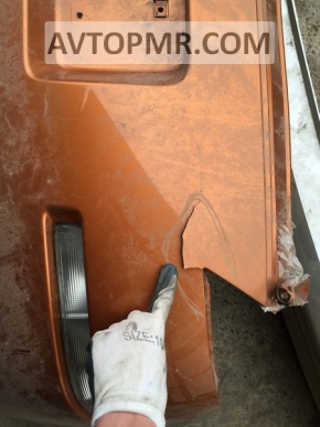 Bare rear bumper with damage on a Nissan 350z.
