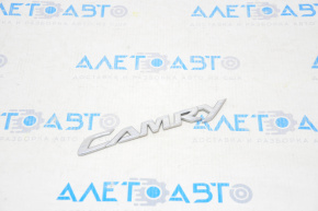 The "CAMRY" emblem on the Toyota Camry v40 trunk lid