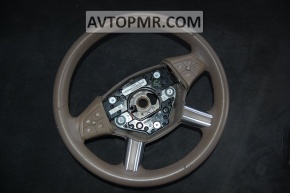 The bare steering wheel of a Mercedes X164 GL pre-restoration is brown.