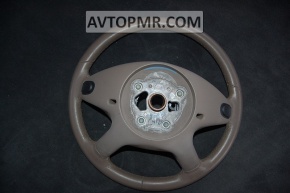 The bare steering wheel of a Mercedes X164 GL pre-restoration is brown.