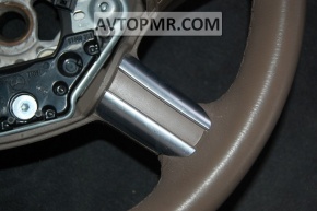 The bare steering wheel of a Mercedes X164 GL pre-restoration is brown.