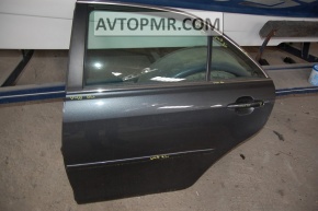 The rear left door is bare, Toyota Camry v40.