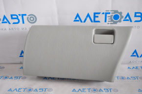 The glove compartment, upper compartment, and gray lid of the Toyota Prius V 12-14