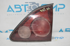 The right inner trunk lid light of a Lexus RX300 98-00 pre-restoration USA is tinted.