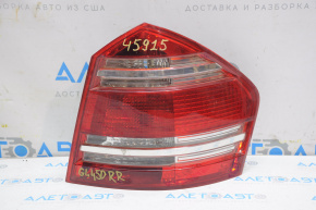 The right headlight of a Mercedes X164 GL has become cloudy and needs polishing.