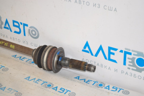 The rear right half shaft of a Subaru Outback 15-19 is rusty.
