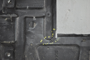 The central engine guard for a Toyota Prius V 12-17 is cracked in two places.