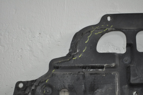 The central engine guard for a Toyota Prius V 12-17 is cracked in two places.