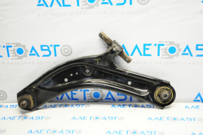 The lower front left control arm of a 14-20 Nissan Rogue has a torn silent block.
