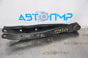 The lower rear left transverse control arm of a Subaru Outback 15-19 is dented.