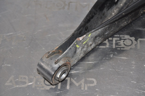 The lower rear left transverse control arm of a Subaru Outback 15-19 is dented.