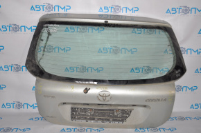The trunk door is bare, Toyota Corolla e12 02-06 5d 3d, diagonally offset.