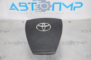 The driver's side airbag in the Toyota Prius 30 10-11 is dark gray.