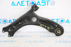 The lower front left control arm of a VW Jetta 11-18 USA has a torn silent block.