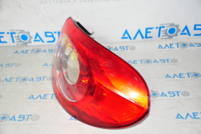Right outer fender light for a VW Tiguan 09-11 pre-restoration, spider web on the glass