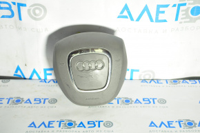 The steering wheel airbag for the driver's side of the Audi A4 B8 08-12 pre-restoration model has worn chrome and scratches.