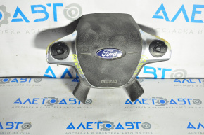 The chrome peeling off on the steering wheel airbag for the driver's side of a Ford Focus mk3 11-18