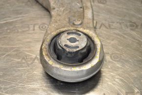 The lower front left control arm of a Jeep Cherokee KL 14-18 has a torn silent block.