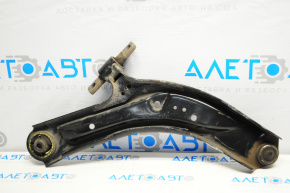 The lower front left control arm of a 14-20 Nissan Rogue has a torn silent block.