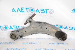 The lower front right control arm of a 14-20 Nissan Rogue has a torn silent block.