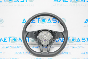 Naked steering wheel for a VW Jetta 19-23, black rubber, no buttons or trim.