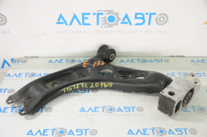 The lower front left control arm of a VW Tiguan 09-17 has a torn silent block.