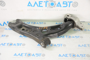 The lower front right control arm of a VW Tiguan 09-17 has a torn silent block.