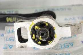 The lower front right control arm of a VW Tiguan 09-17 has a torn silent block.