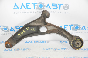 The lower front left control arm of a Dodge Journey 11-20 has a torn silent block.