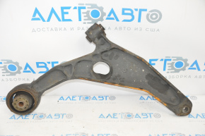 The lower front left control arm of a Dodge Journey 11-20 has a torn silent block.