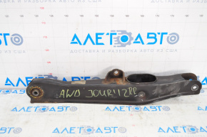 The lower rear right control arm of a Dodge Journey 11-20 has a torn silent block.