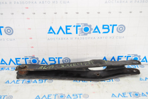 The lower rear right control arm of a Dodge Journey 11-20 has a torn silent block.