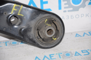 The lower front left control arm of a Toyota Prius 30 10-15 is torn.