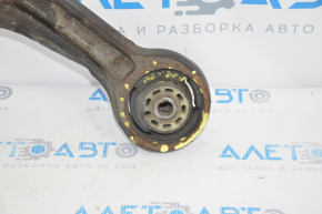 The lower front left control arm of a Dodge Journey 11-20 has a torn silent block.