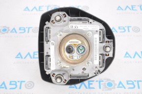 The airbag in the driver's steering wheel of a Toyota Camry v70 18-24 is black and has been shot.