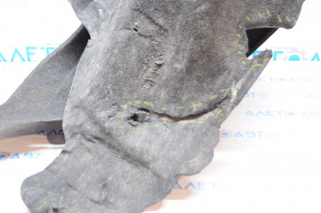 The rear right fender liner of a 14-20 Nissan Rogue is torn.