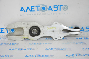 The lower control arm under the rear right spring of the Ford Escape MK4 20-26 is dented.