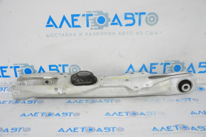 The lower control arm under the rear right spring of the Ford Escape MK4 20-26 is dented.