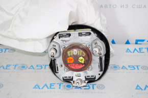 The airbag in the driver's steering wheel of the Mazda CX-9 16-23 exploded.