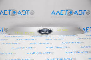 Upper trunk door molding with emblem Ford Escape MK3 13-16 pre-restoration under camera emblem defect