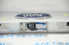 Upper trunk door molding with emblem Ford Escape MK3 13-16 pre-restoration under camera emblem defect