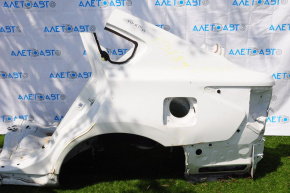 Rear left quarter wing of a 1913-15 Nissan Altima, pre-restored white, dents, with a central pillar