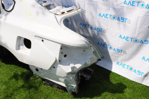 Rear left quarter wing of a 1913-15 Nissan Altima, pre-restored white, dents, with a central pillar