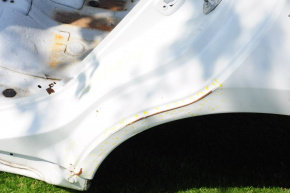 Rear left quarter wing of a 1913-15 Nissan Altima, pre-restored white, dents, with a central pillar