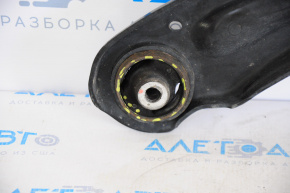 The lower front left control arm of a VW Jetta 11-18 USA has a torn silent block.