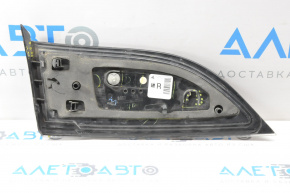 The right inner taillight of a Chevrolet Volt 11-15 has a broken mount and a chip.